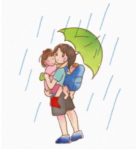 雨の中二人抱っこするママ